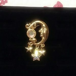 Gold broach with aurora borialus stones